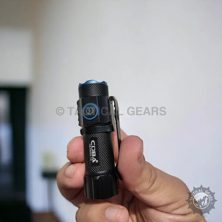 COBA Pocket Rechargeable LED Flashlight with blue power button and pocket clip