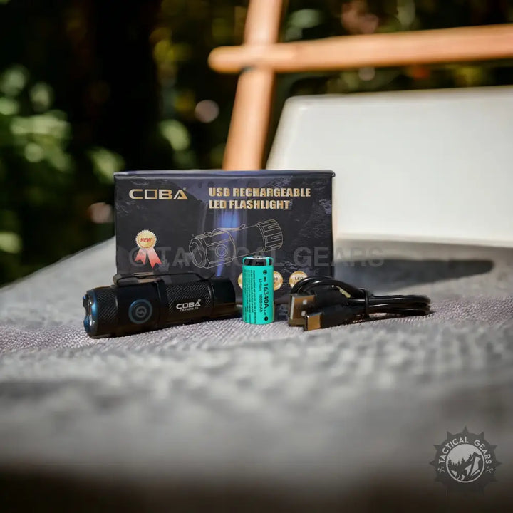Black Coba Pocket Rechargeable LED Flashlight with teal battery and charging cable