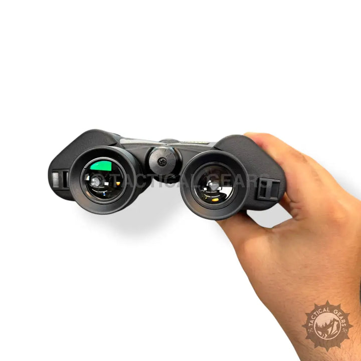 Black handheld 7x50 binoculars with green-coated objective lenses for astronomy viewing