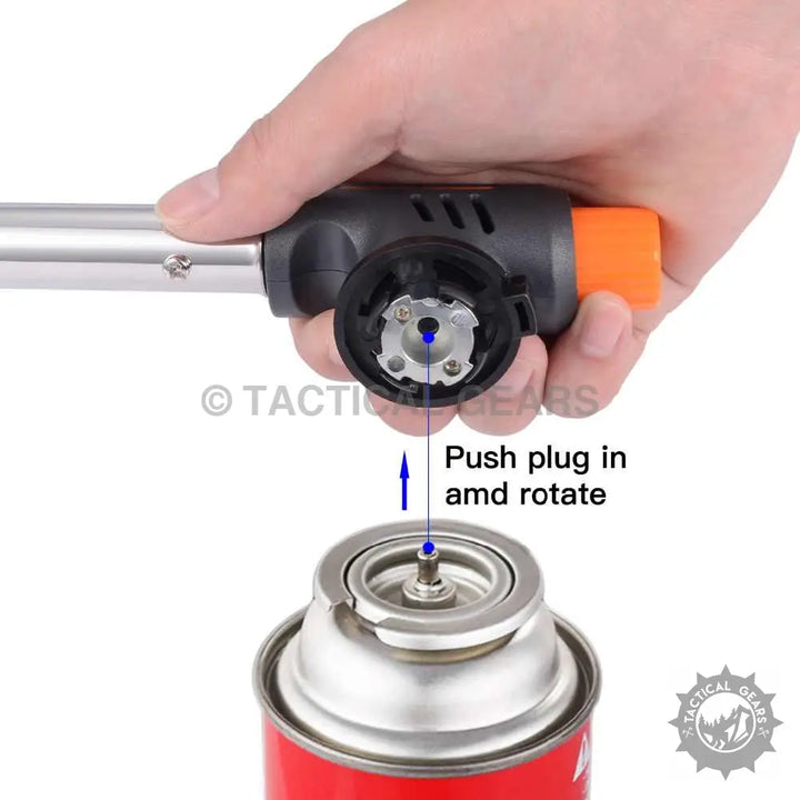 Person’s hand connecting butane gas torch to gas canister for multi-purpose use