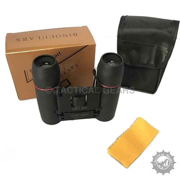 Black compact binoculars with red rings on barrels for clear, portable viewing size