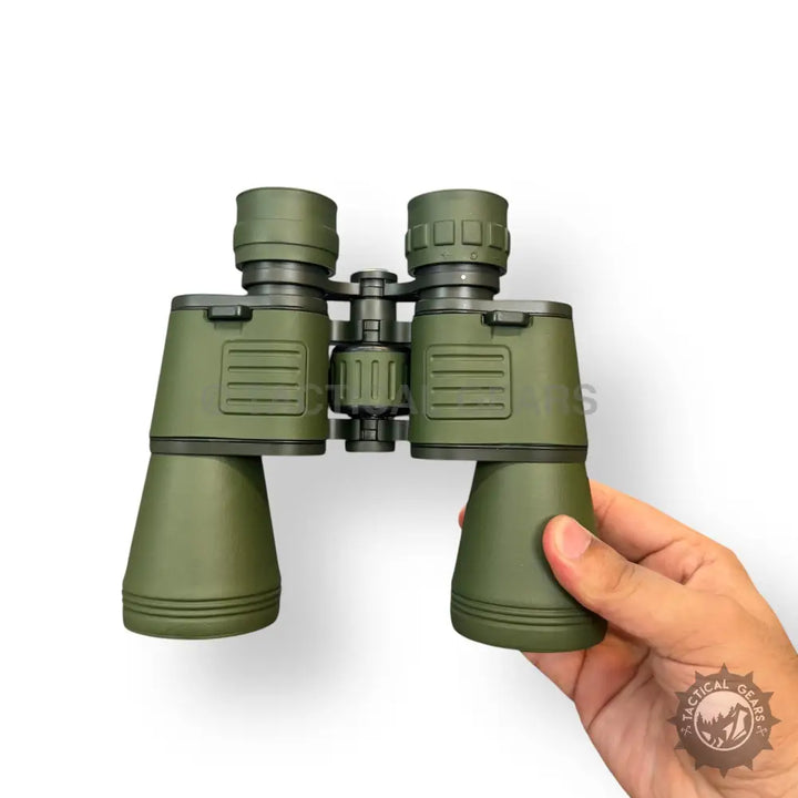 Olive green military-style Conquest Seeker 20x50 binoculars with textured grip for outdoor viewing