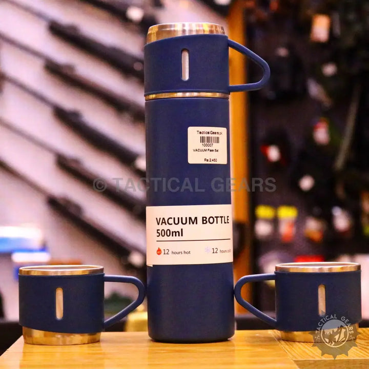 Dark blue vacuum flask set with two matching cups for hot and cold beverages
