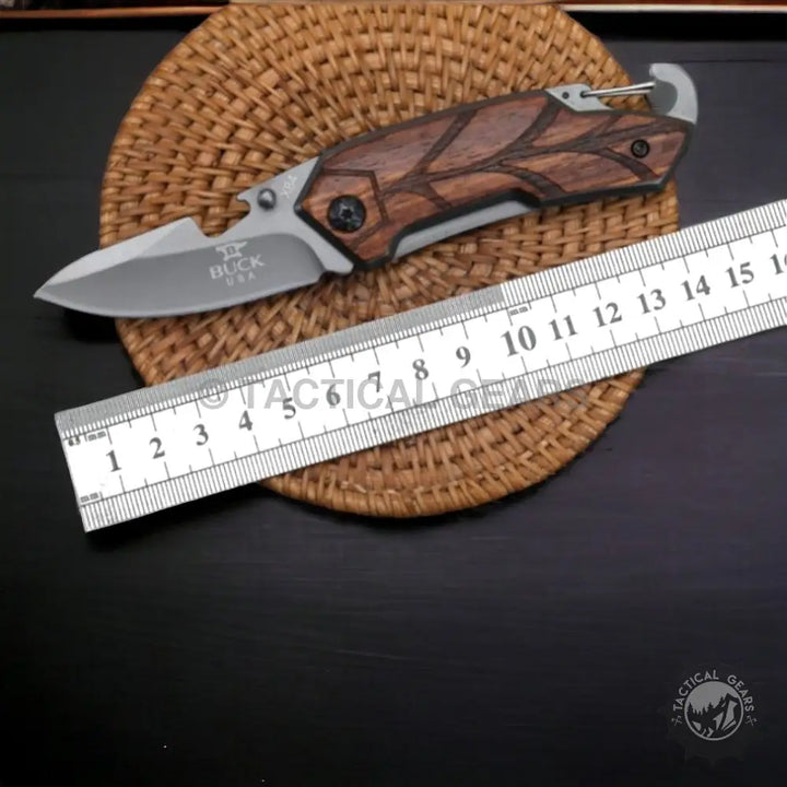Compact Pocket Folding Knife Buck x84 with wooden handle and leaf design, includes carabiner clip