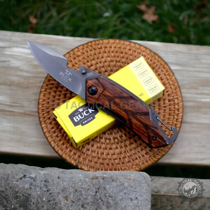 Pocket Folding Knife Buck x84 with dark wood handle and 3.5-inch grey blade
