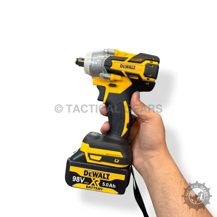 Yellow and black cordless DeWalt impact wrench with 98V 5.0Ah battery in complete tools set
