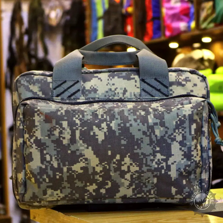 Digital camouflage tactical bag with top handles and exterior zippered pocket for laptop