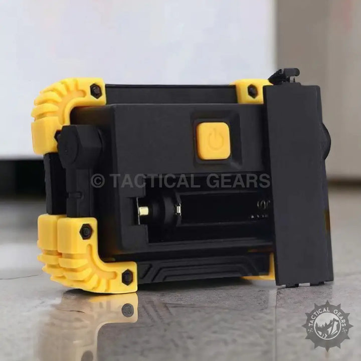 Black and yellow rechargeable flood light with open battery compartment for Super Bright Flood Light