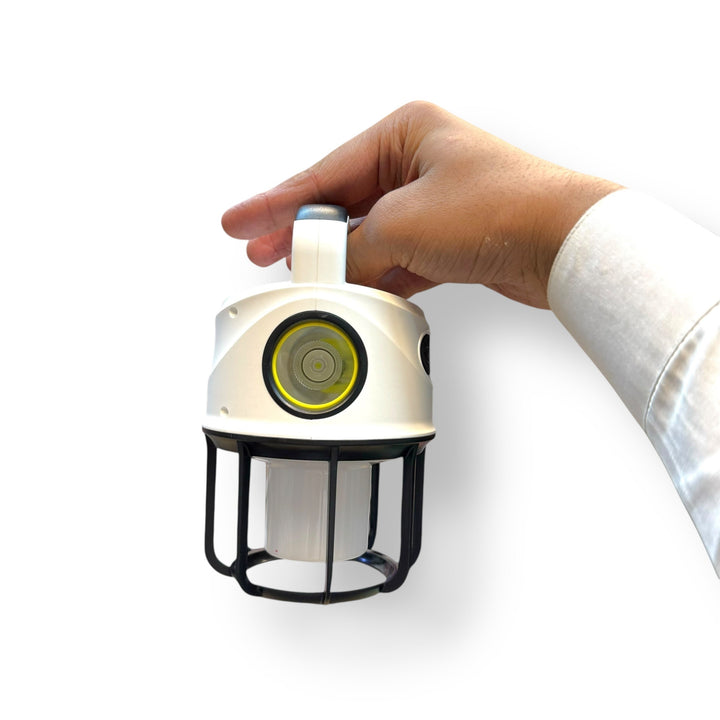 Portable Dual Light Camping Lantern with Built-In Level Held by Hand