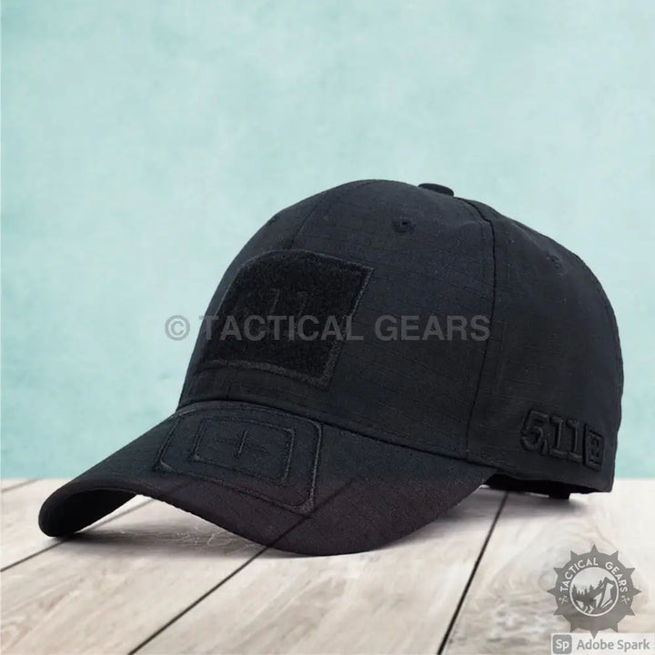 Black tactical baseball cap with hook-and-loop patch areas for outdoor and tactical use