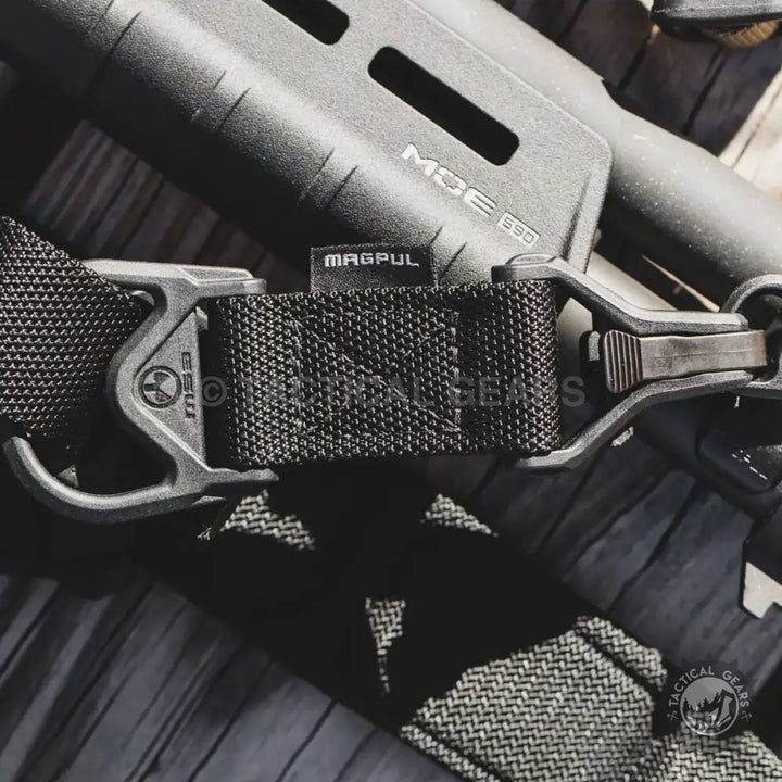 Black tactical sling with metal hardware for firearm featuring two-point attachment and extreme resistance