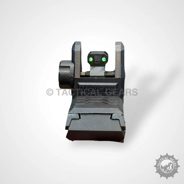 Black metal flip-up rifle sight with green fiber optic dots for precise aiming