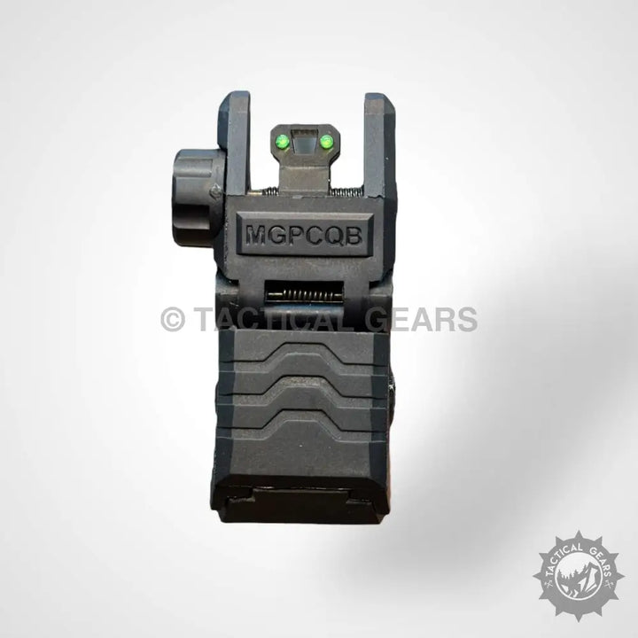 Black flip-up iron sight with green fiber optic dots for precise aiming