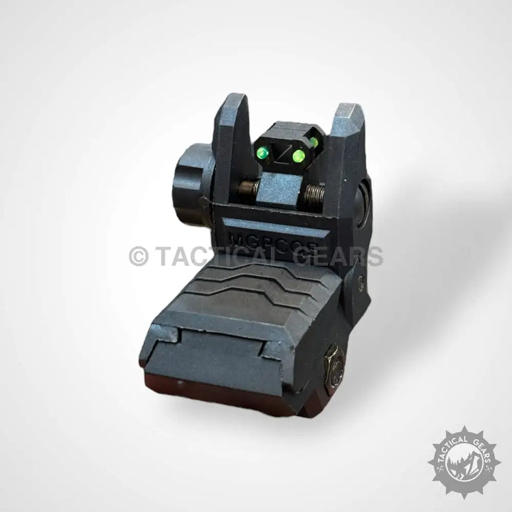 Black flip-up tactical iron sight with green fiber optic dots for precise aiming