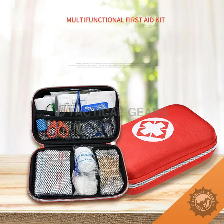 Red zippered First Aid Kit with white cross symbol open showing medical supplies