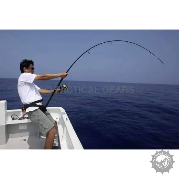 Man on a boat fishing with a 7 Ft fishing rod, bent rod, spinning reel, and fishing line