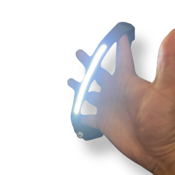 Flexible LED Strip Headlamp with side-mounted spotlight held by hand, wearable LED device