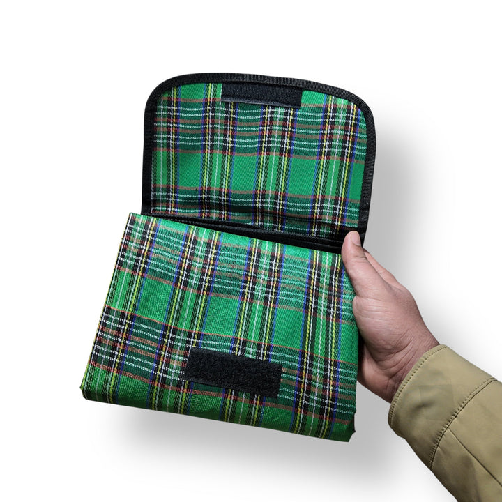Green plaid fabric picnic sheet with black hook-and-loop fasteners, foldable and imported