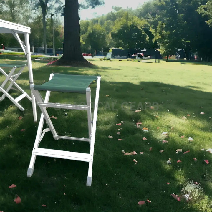 Portable folding camping picnic table with aluminum frame and green fabric seat