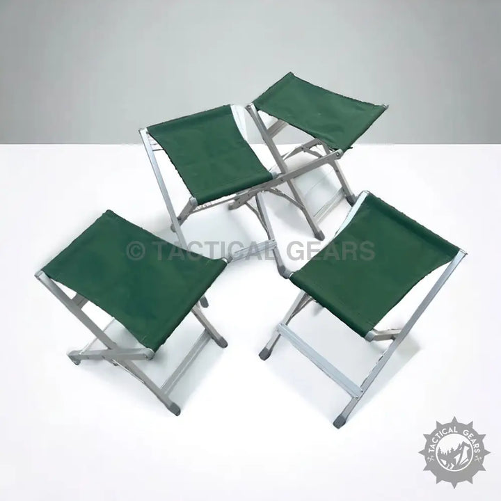 Four green folding camping picnic stools with aluminum frame for outdoor adventures