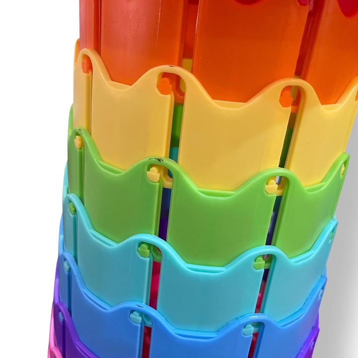 Colorful stacked plastic folding carrying stool with wavy edges and holes for portability