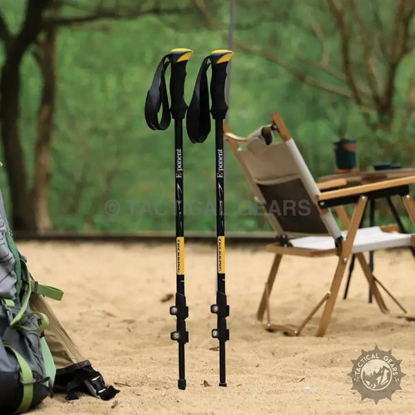 Black and yellow trekking stick with adjustable straps for hiking and trekking adventures