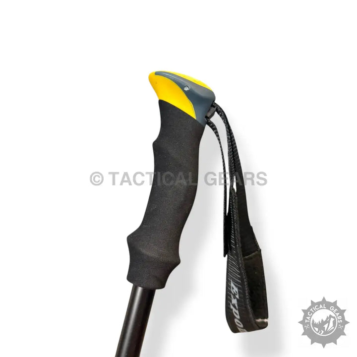 Black folding hiking stick with ergonomic handle and adjustable wrist strap