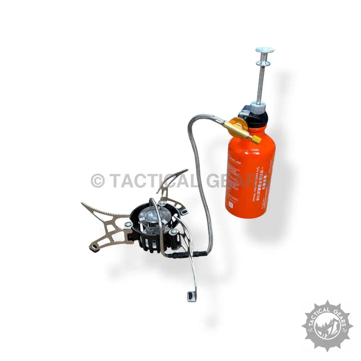 Folding Portable Camping Stove with orange liquid fuel bottle for outdoor cooking