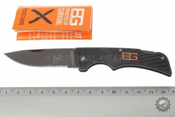 Gerber Bear Grylls compact scout knife with grey orange handle and drop point blade