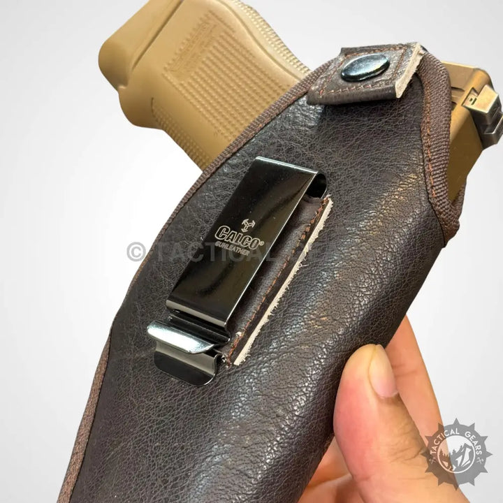 Brown leather gun leather holster with metal belt clip for Galco Gun Leather products