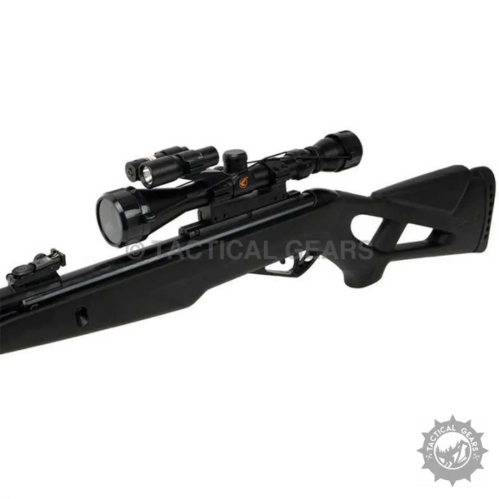 Black Gamo Whisper X air rifle with scope and mounted flashlight for silent shooting