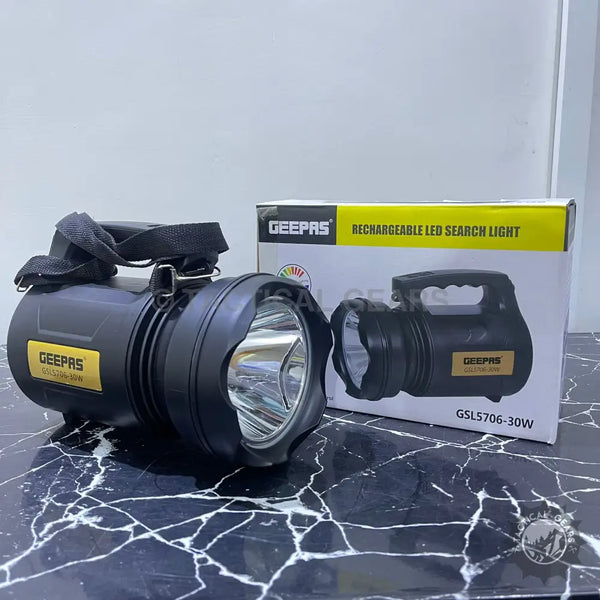 Black rechargeable LED searchlight with handle and shoulder strap for outdoor activities security