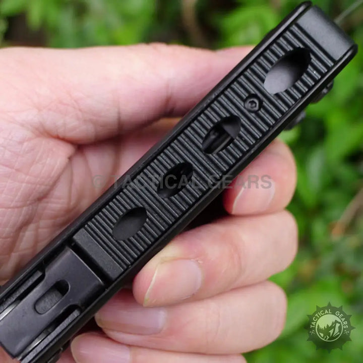 Gerber Bear Grylls Ultimate multi-tool with black tactical flashlight, textured grip, mounting points, screwdriver bits