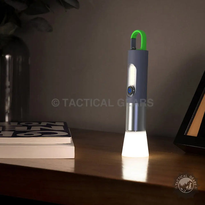 GT10 Outdoor Camping Flashlight: Cylindrical gray and silver portable outdoor camping light with green handle