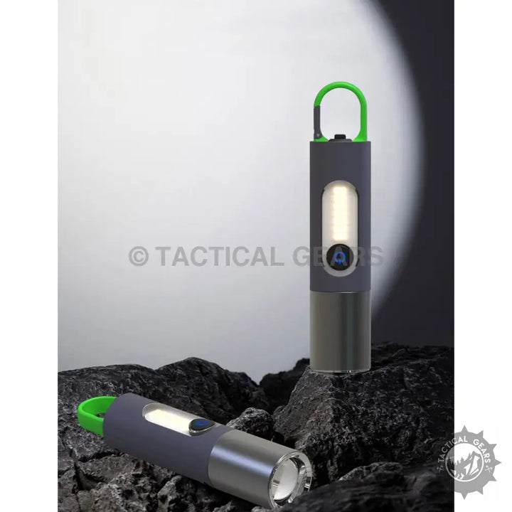 GT10 Outdoor Camping Flashlight with sleek grey design, green keychains, and illumination