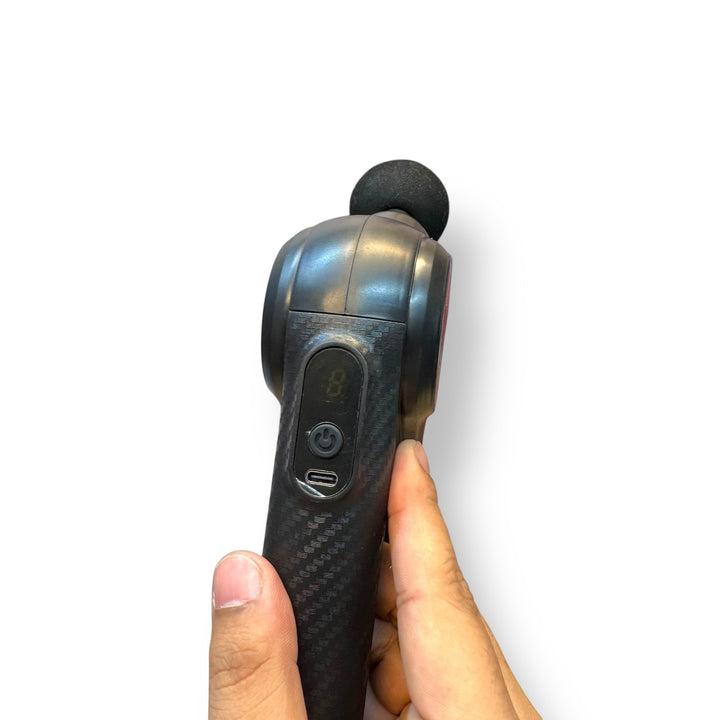 Handheld muscle massager with 9 heads and textured grip for deep tissue relief