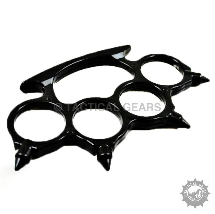 Black metal brass knuckles with pointed studs for a tough hand grip and protection
