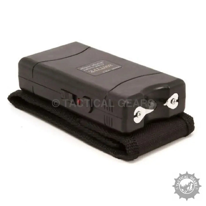 Black rectangular stun gun TW-800 with exposed prongs and safety switch for self-defense