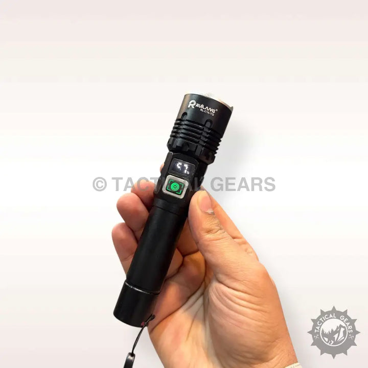 Black handheld tactical flashlight with digital display and green power button for high power emergency use