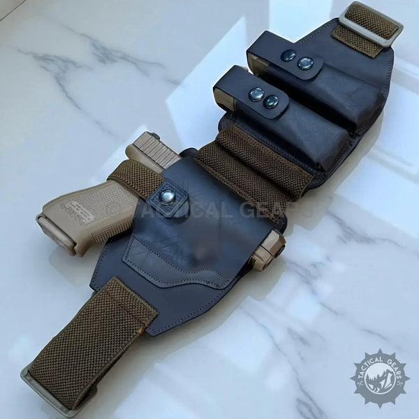 Dark leather tactical belly band waist holster with tan pistol and magazine pouches