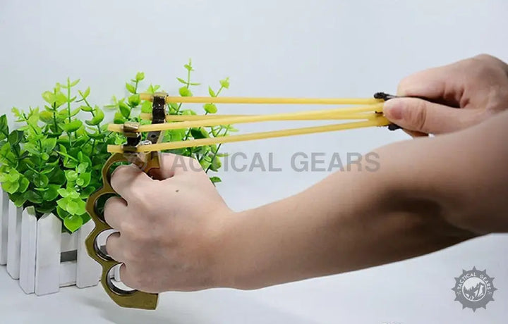High quality brass knuckle slingshot with multiple elastic bands for tactical use