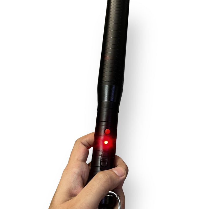 Black high-voltage pulse baton tactical flashlight with red indicator light for security use