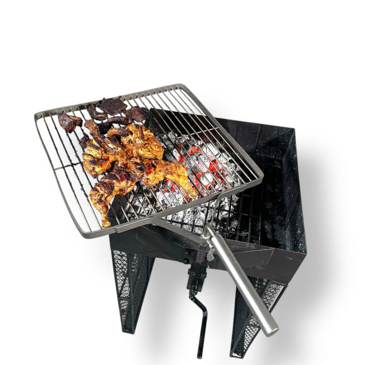 Imported robust charcoal grill with rotisserie cooking chicken and beef outdoors