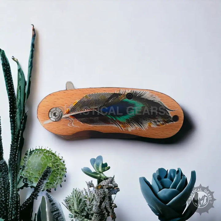 Jeep Mini stainless steel folding knife with wooden handle featuring peacock feather design