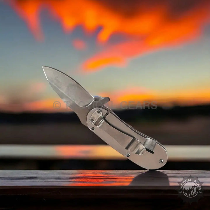 Silver-colored Jeep Mini folding knife with stainless steel blade and clip for outdoor use