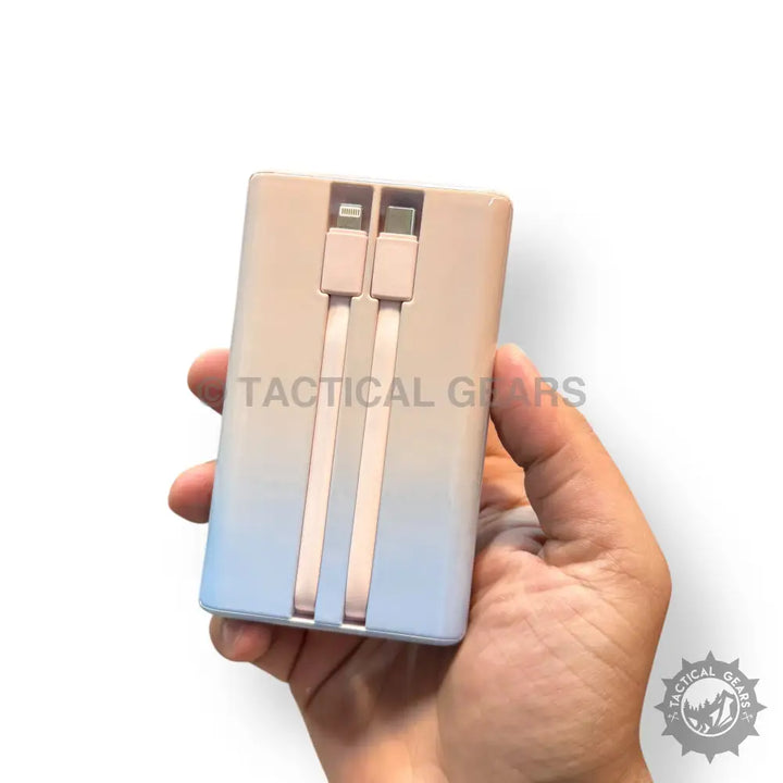 Kamal 67W Gradient Super Fast Power Bank with integrated Lightning and USB-C cables in hand
