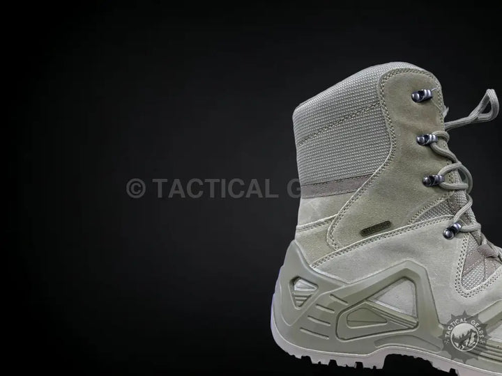 Light-colored tactical boots with laces and rugged sole, perfect for outdoor adventures