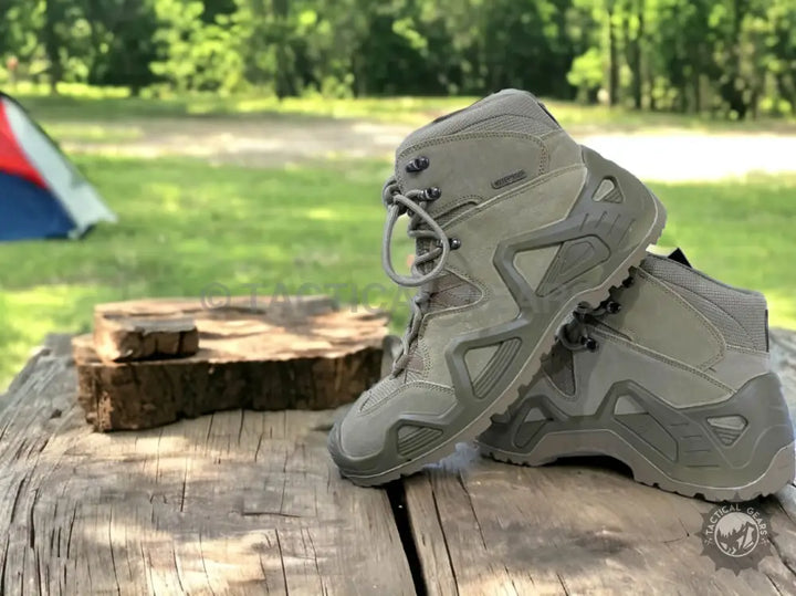 Olive green Khaki Tactical waterproof hiking boots with textured soles and lace-up closure