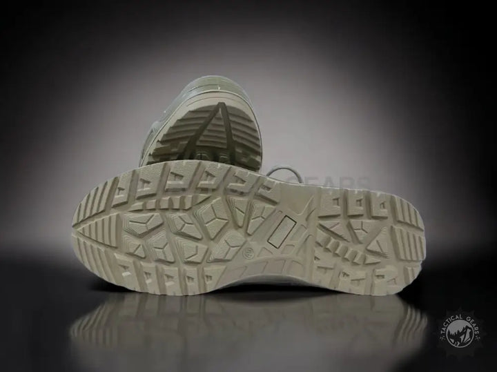 Durable tread pattern on light-colored Khaki Tactical Waterproof Boots sole for tactical durability
