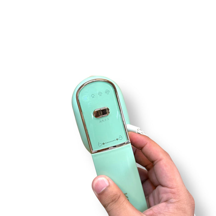 Mint green Konka Travelling Steam Iron with foldable design, portable steam iron for travel